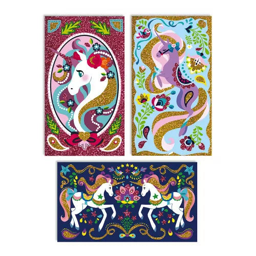 Three completed unicorn glitter art panels in red blue and dark blue