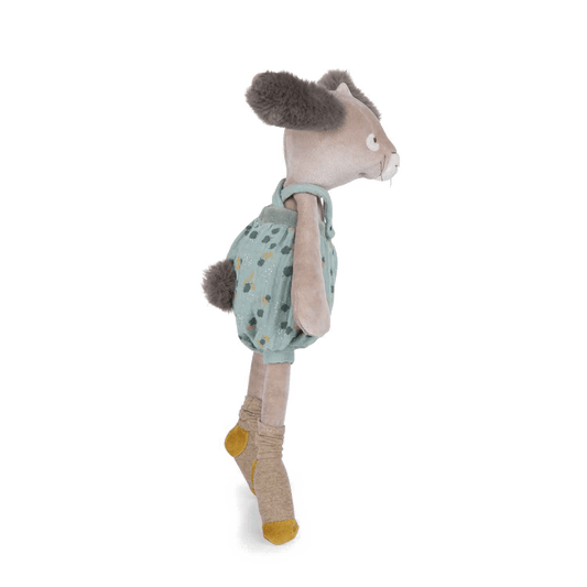 Side profile of sage green outfit plush rabbit showing fluffy tail