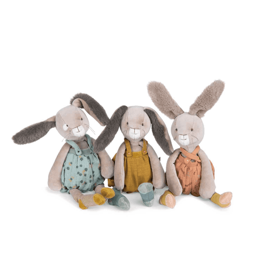 Set of three plush rabbits in blue, mustard, and terracotta overalls