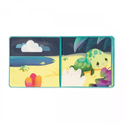 Nighttime beach scene in open Janod bath book with two turtles on sand