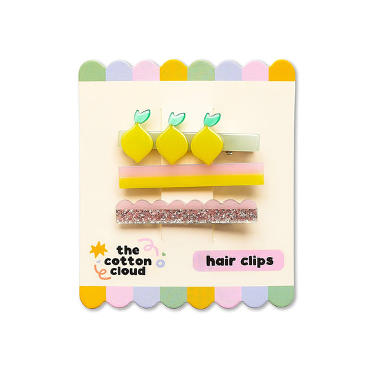 Pack of three yellow lemon-shaped acetate hair clips on card