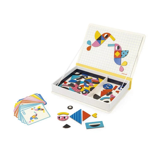 Two bird figures made from JANOD magnetic pieces displayed on open book with model cards