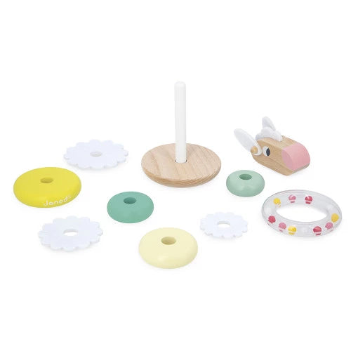 All components of Janod wooden sheep stacking toy laid out for assembly