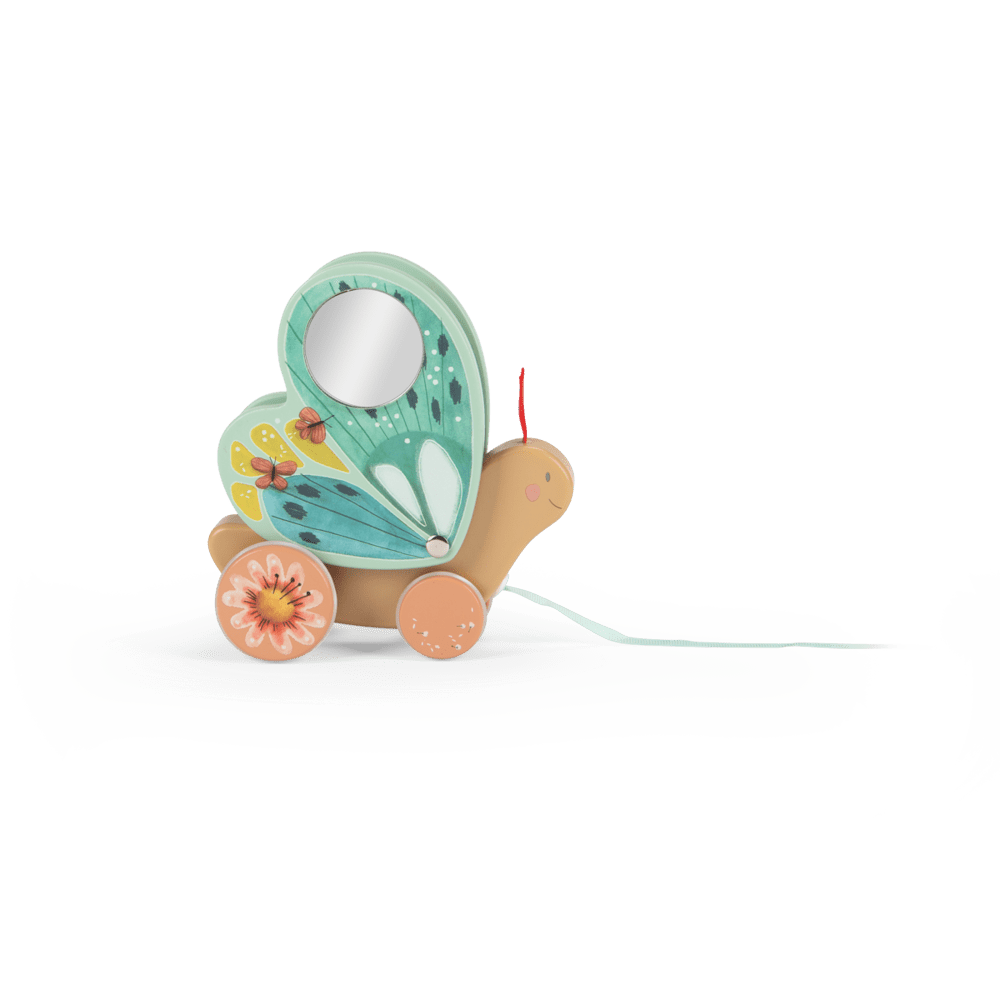 Side profile of wooden butterfly pull toy with smiling face, mirror wing, and blue ribbon