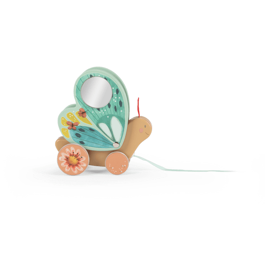 Side profile of wooden butterfly pull toy with smiling face, mirror wing, and blue ribbon