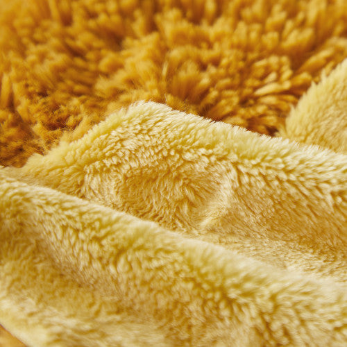 Close-up of soft golden-yellow plush texture on KALOO lion toy