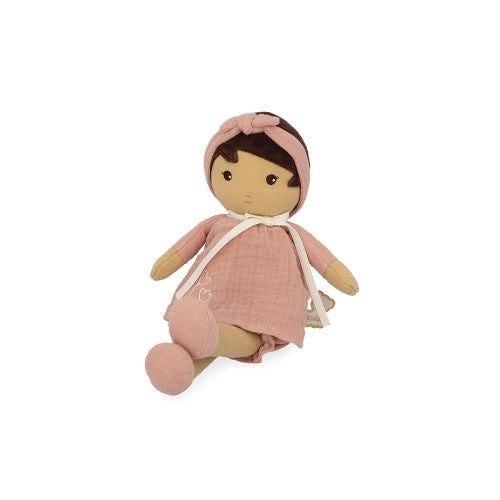 Seated Kaloo Amandine baby doll showing pink textured dress and heart embroidery