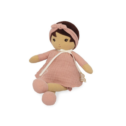 Seated Kaloo Amandine cloth doll wearing pink headband, dress, and bloomers against white background