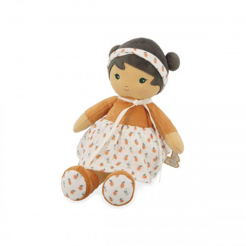 Seated Kaloo Eloise doll showing pineapple pattern on boot soles