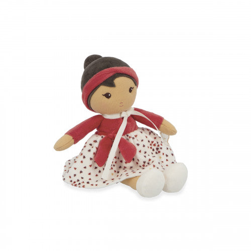 Seated Kaloo Émilie fabric doll showing red outfit and heart patterned skirt