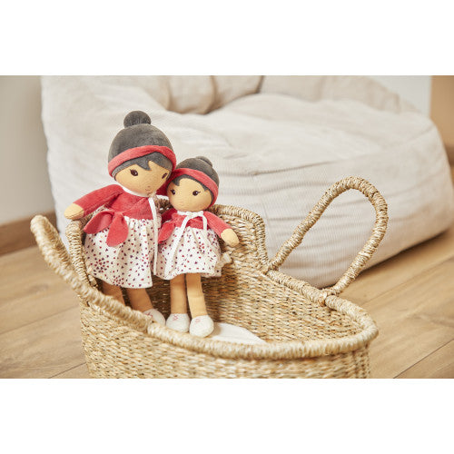 Two Kaloo dolls in grey hats and polka dot skirts in woven basket