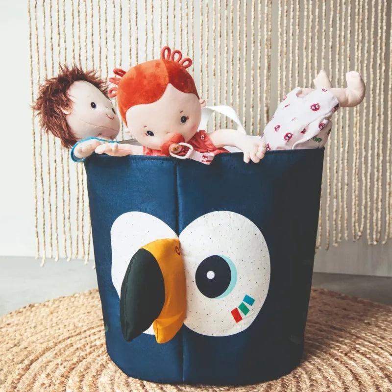 Blue toucan storage bin holding Rose and other Lilliputiens dolls