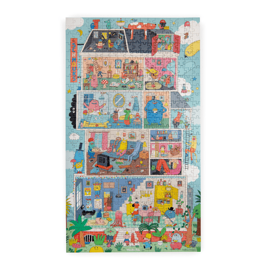 Completed 500-piece Les Schmouks jigsaw puzzle displaying a whimsical multi-story house cutaway