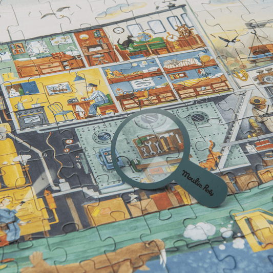 Assembled explorer ship jigsaw puzzle with magnifying glass detail