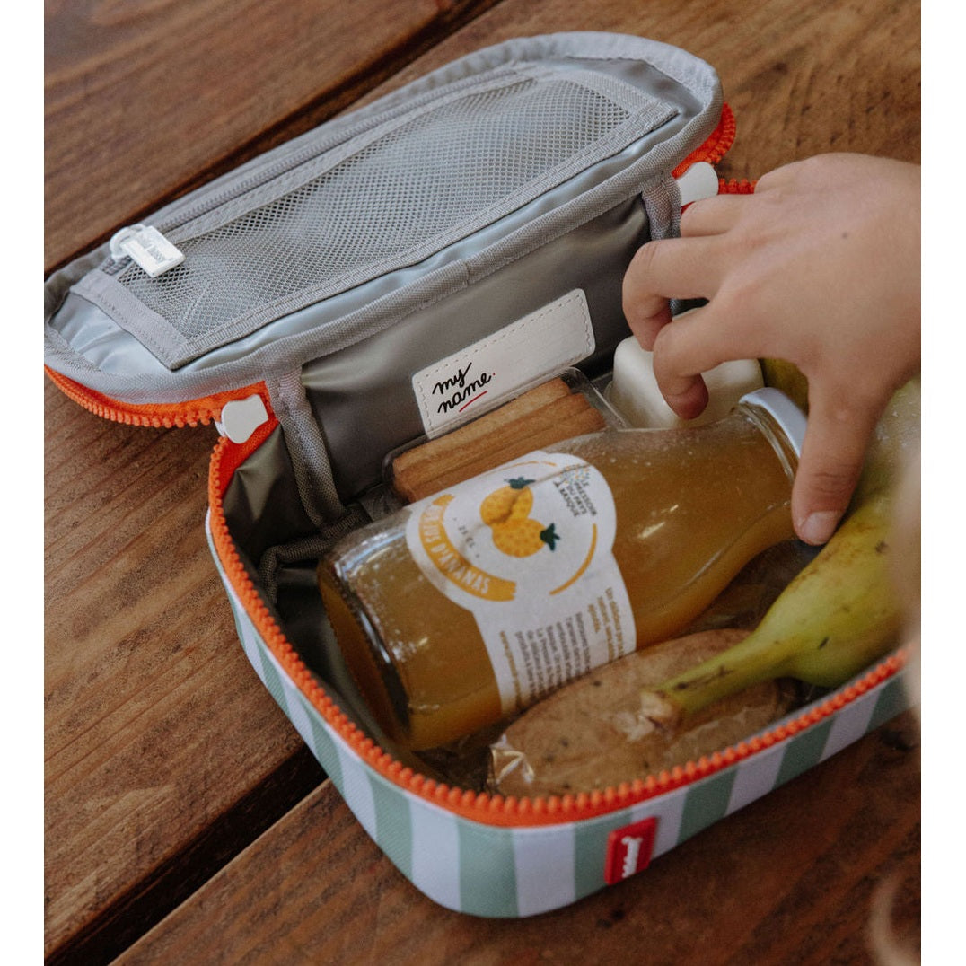 Green striped insulated lunch bag with orange zipper holding snacks and bottle