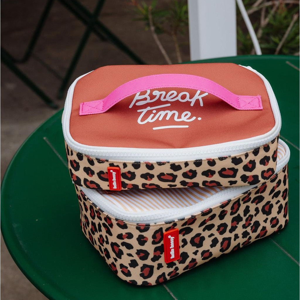 Two-tiered leopard print insulated lunch bag with terracotta lid and pink handle