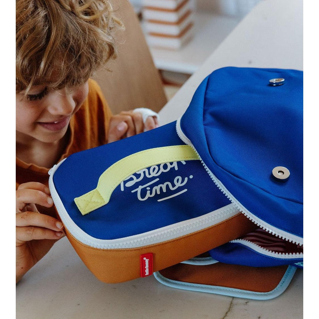Child opening blue and orange insulated lunch bag to show interior