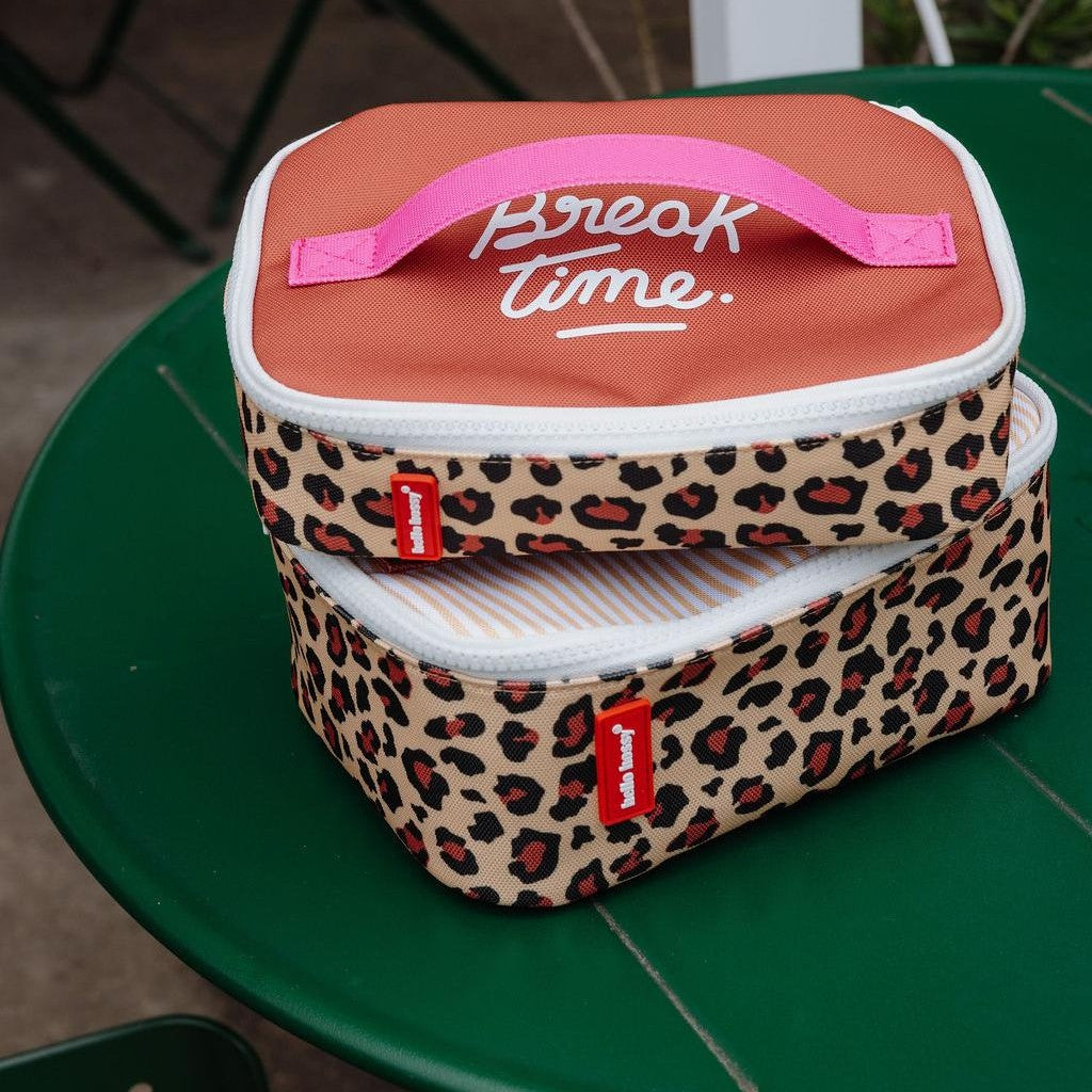 Two stacked Hello Hossy insulated lunch bags with leopard print exterior