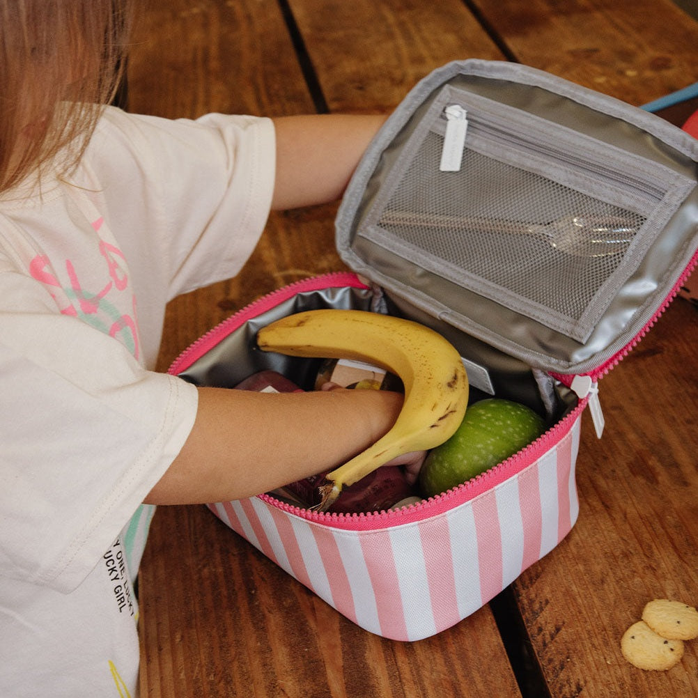 Open pink striped insulated lunch bag showing silver lining and mesh pocket