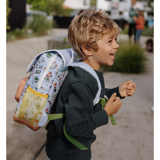 Running child modeling green strap kids backpack with yellow mesh pocket
