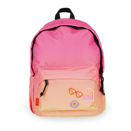 Pink to orange gradient backpack with decorative patches and black zippers