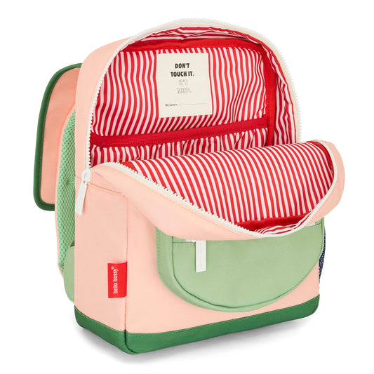 Interior of pink kids backpack with striped lining and name tag