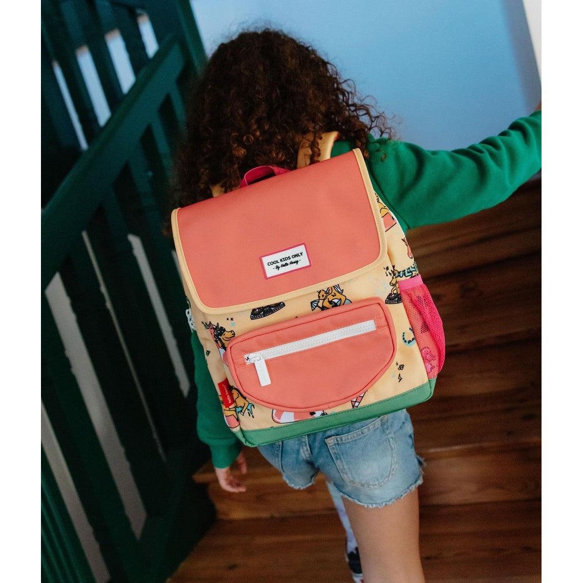 Kids unicorn backpack fit on child walking up stairs