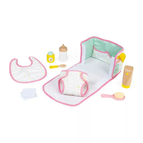 Flat lay of Janod nursery doll care set with changing mat and accessories