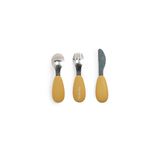 Moulin Roty silicone cutlery set for toddlers with mustard yellow ergonomic handles