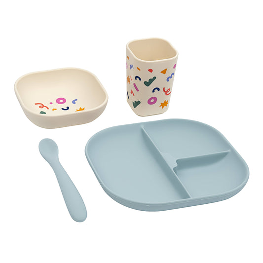 Light blue silicone divided plate and matching dinnerware set flat lay