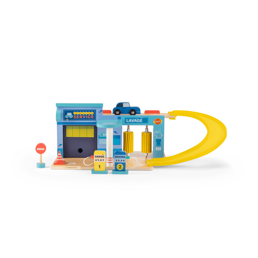 Full view of retro wooden toy service station with car wash ramp and fuel pumps