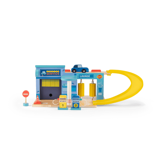 Full view of retro wooden toy service station with car wash ramp and fuel pumps