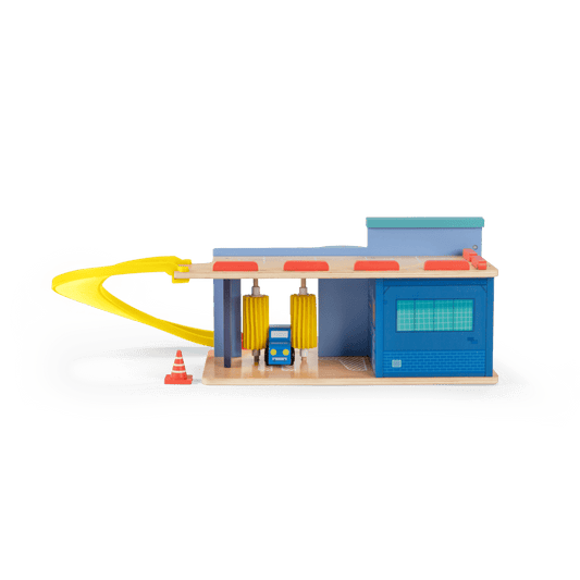 Rear view of wooden toy station with car wash brushes and curved yellow ramp