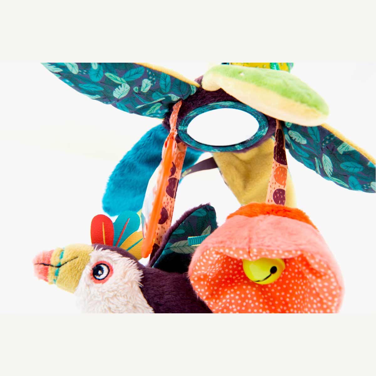 Close-up of Moulin Roty activity toy mirror ring and pink bell flower detail