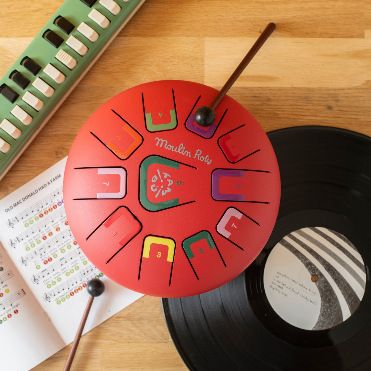 Les Popipop red steel tongue drum with sheet music and number stickers