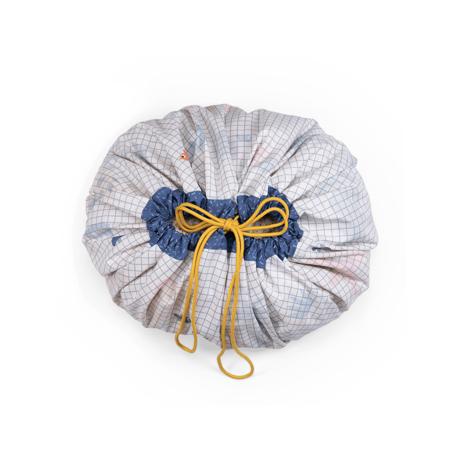 Les Toupitis playmat gathered into storage bag with yellow drawstring