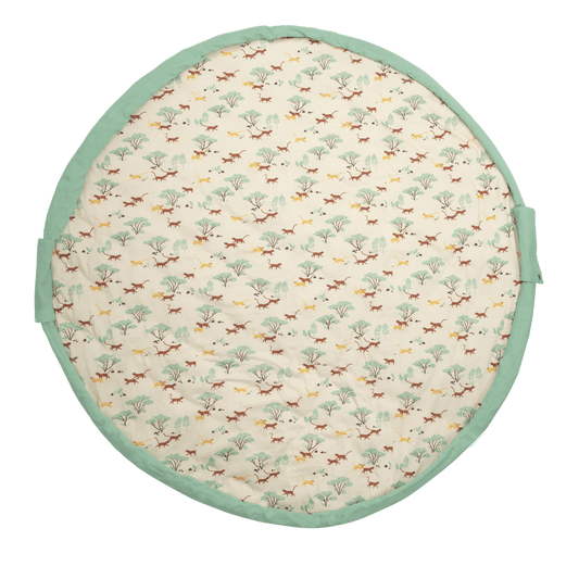 Flat lay of circular cat-print cotton playmat with mint-green rim handles