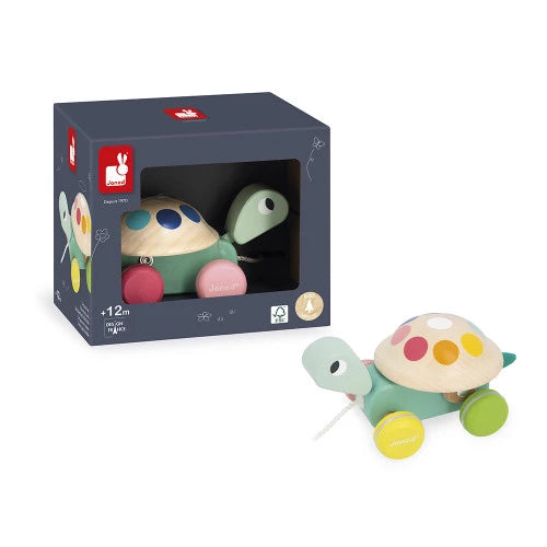 Janod wooden pull-along turtle toy with rainbow shell stickers and silent rubber wheels in packaging