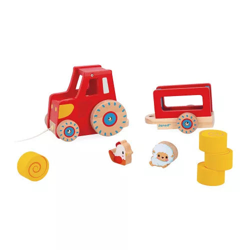 Disassembled Janod red wooden tractor set with detachable trailer and farm figures