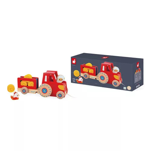 Janod red wooden tractor toy set in packaging with hay bales and farm animals