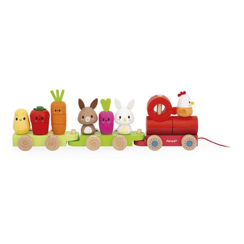 Assembled JANOD wooden farm pull-along train with red engine, green wagons, and vegetable figures