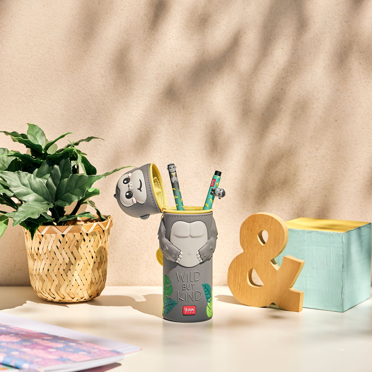 Grey Gorilla Kawaii pencil case transformed into upright pen holder with pencils on desk