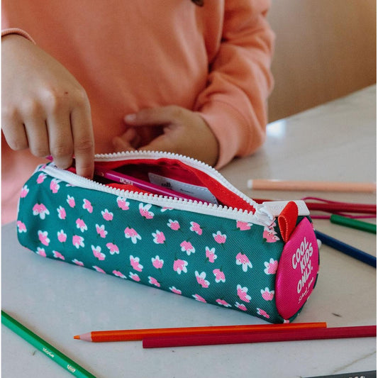 Girl organizing colorful pencils in green floral Garden Joy case