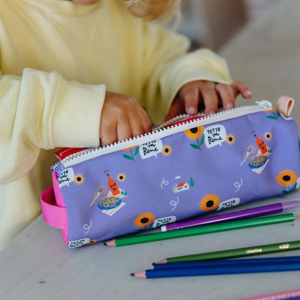 Child opening purple sunflower pencil case with white zipper and pink handle