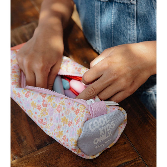 Hands opening Hello Hossy floral pencil case revealing coral interior and loop handle