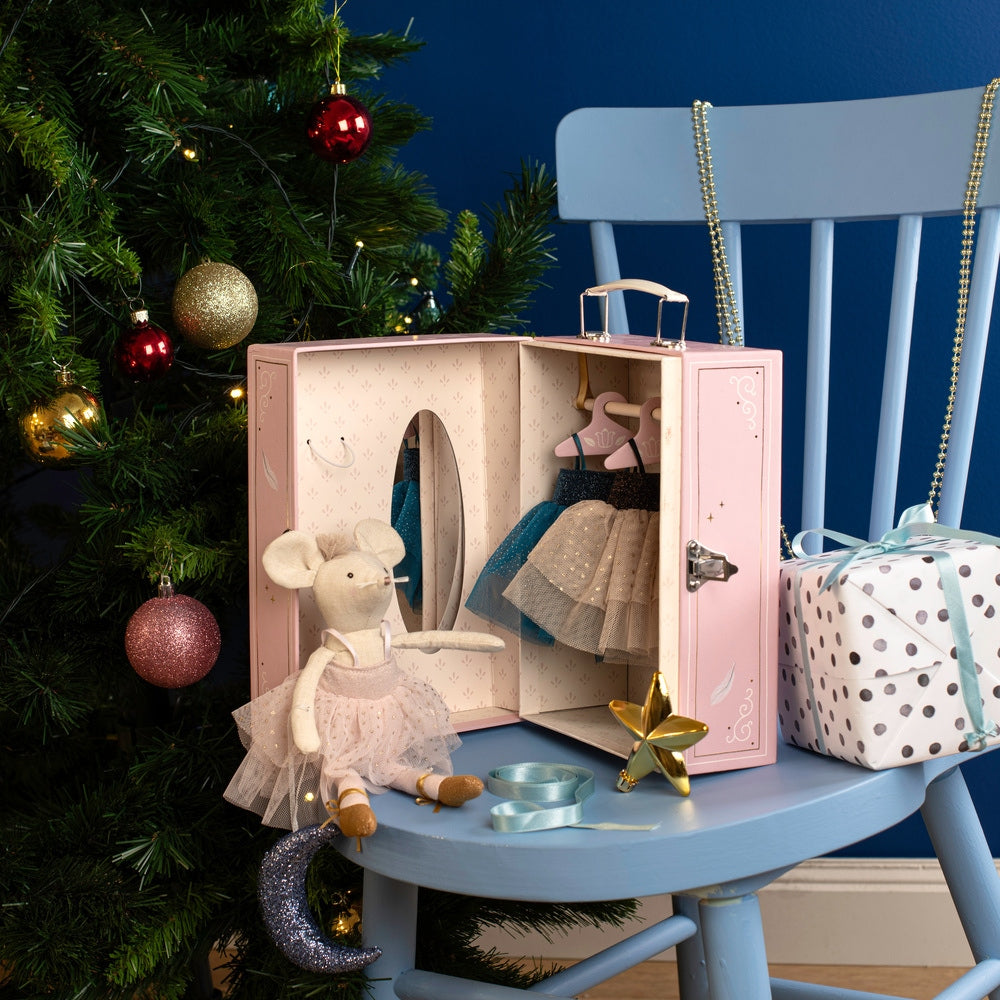 Open pink ballet suitcase wardrobe displaying hanging tutus and mirror