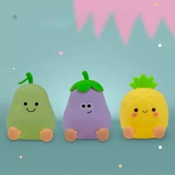 Unlit cartoon fruit night lights: green pear, purple eggplant, yellow pineapple