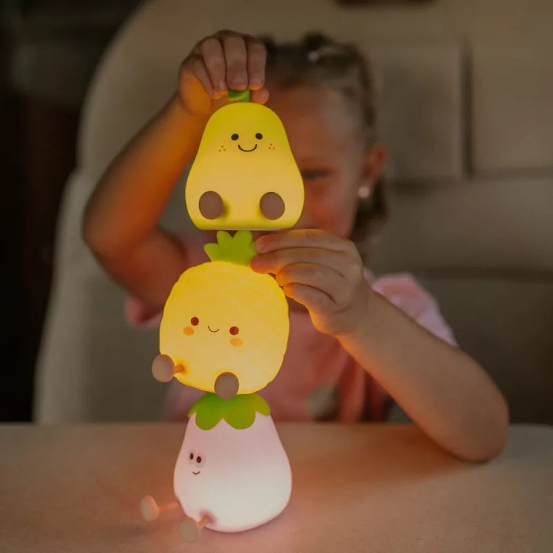 Stackable silicone fruit night lights with cute faces and warm glow