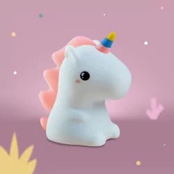 White silicone unicorn night light with pastel pink mane and striped horn