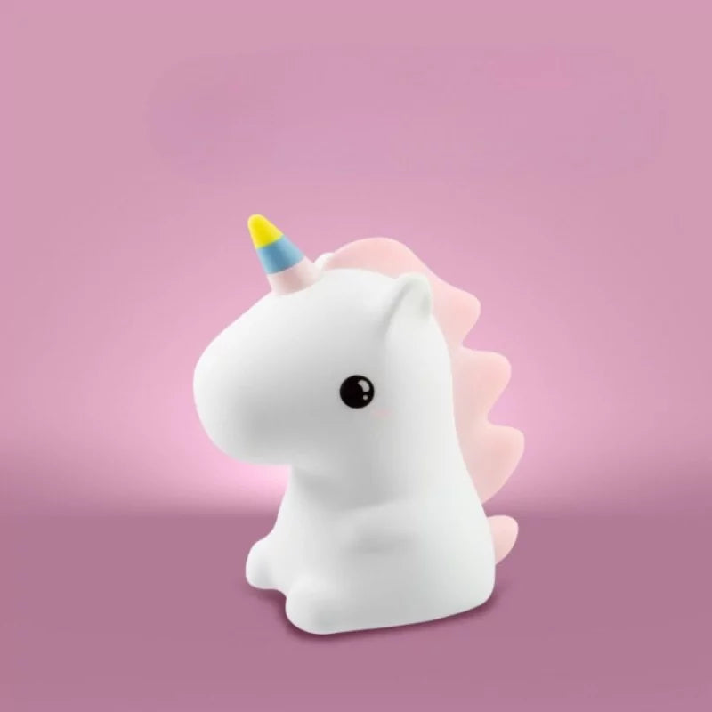 Unlit white silicone unicorn lamp with scalloped pink mane on pink background